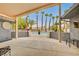 Covered patio area overlooking the pool and beautiful palm trees at 1970 Del Font Ct, Las Vegas, NV 89117