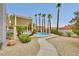 Sparkling pool area showcasing desert landscaping and tall palm trees at 1970 Del Font Ct, Las Vegas, NV 89117