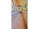 View of a condominium balcony with concrete flooring and metal railing overlooking trees at 2000 Gravel Hill St # 203, Las Vegas, NV 89117
