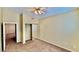 Bedroom with neutral walls, ceiling fan and mirrored closet at 2000 Gravel Hill St # 203, Las Vegas, NV 89117