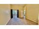 Bedroom featuring neutral carpet and walls with door to a balcony with a view of greenery at 2000 Gravel Hill St # 203, Las Vegas, NV 89117