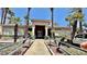 Community clubhouse with palm trees and well-maintained landscaping at 2000 Gravel Hill St # 203, Las Vegas, NV 89117