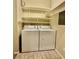 Clean laundry room with washer, dryer and storage shelves at 2000 Gravel Hill St # 203, Las Vegas, NV 89117