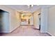 Open-concept living area featuring carpet, neutral tones, fan, kitchen and natural light at 2000 Gravel Hill St # 203, Las Vegas, NV 89117