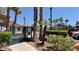 View of the community pool area with seating and palm trees at 2000 Gravel Hill St # 203, Las Vegas, NV 89117