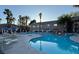 Community pool area with landscaping, lounge chairs, and waterfall feature at 2000 Gravel Hill St # 203, Las Vegas, NV 89117