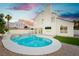 Backyard view of the home featuring a swimming pool and jacuzzi with desert landscaping at 2107 Fountain Springs Dr, Henderson, NV 89074