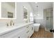 Bright bathroom boasting double vanities, a standalone tub, and a modern glass shower at 2107 Fountain Springs Dr, Henderson, NV 89074