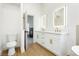 Bright bathroom features a double sink vanity with gold fixtures, and a toilet at 2107 Fountain Springs Dr, Henderson, NV 89074