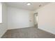 Neutrally designed bedroom featuring carpeted floors and bright natural lighting at 2107 Fountain Springs Dr, Henderson, NV 89074