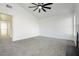 Bedroom featuring a fireplace, ceiling fan, and access to other rooms in the home at 2107 Fountain Springs Dr, Henderson, NV 89074