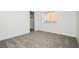 Bedroom filled with natural light, plush carpet, window and closet at 2107 Fountain Springs Dr, Henderson, NV 89074