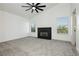 Bright bedroom with a ceiling fan, modern fireplace, and large windows offering natural light at 2107 Fountain Springs Dr, Henderson, NV 89074