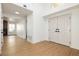 Inviting entryway featuring wood-look flooring, high ceilings, and direct access to various areas of the home at 2107 Fountain Springs Dr, Henderson, NV 89074