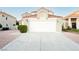 Charming home featuring a spacious driveway, two-car garage, and low-maintenance landscaping in a well-kept community at 2107 Fountain Springs Dr, Henderson, NV 89074