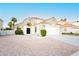 Charming single-Gathering home featuring a well-maintained front yard with desert landscaping and a two-car garage at 2107 Fountain Springs Dr, Henderson, NV 89074