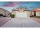 Charming home featuring a spacious driveway, two-car garage, and low-maintenance landscaping in a well-kept community at 2107 Fountain Springs Dr, Henderson, NV 89074