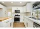 Bright kitchen featuring stainless steel appliances, stylish white cabinetry and hardware, and butcher block island at 2107 Fountain Springs Dr, Henderson, NV 89074