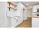 Bright kitchen with white cabinets, light countertops, and modern hardware with stainless steel appliances at 2107 Fountain Springs Dr, Henderson, NV 89074