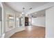 Spacious living room with updated flooring, modern lighting, fireplace and views of the backyard at 2107 Fountain Springs Dr, Henderson, NV 89074