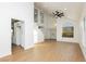 Spacious living area with wood-look floors, and high ceilings; connects seamlessly with other areas of the home at 2107 Fountain Springs Dr, Henderson, NV 89074