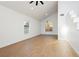 Bright and airy living room featuring vaulted ceilings, wood-look flooring and arched windows, offering ample natural light at 2107 Fountain Springs Dr, Henderson, NV 89074