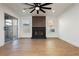 Bright living room with a sleek black fireplace and wood flooring, creating a modern and inviting atmosphere at 2107 Fountain Springs Dr, Henderson, NV 89074