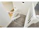 Carpeted staircase with white railings providing a view into an open-concept home at 2107 Fountain Springs Dr, Henderson, NV 89074