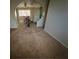 Bright living room features carpet floors and natural light at 217 Kola St, Henderson, NV 89015