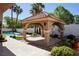 Backyard features a covered gazebo and a sparkling in-ground pool, perfect for outdoor entertaining at 2208 Fiero Dr, Las Vegas, NV 89134
