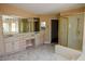 Spacious bathroom features double sinks, shower, and walk-in closet at 2208 Fiero Dr, Las Vegas, NV 89134