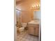 Cozy bathroom features a shower-tub combo and a vanity with ample lighting at 2208 Fiero Dr, Las Vegas, NV 89134