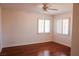 Bedroom with a ceiling fan, hardwood floors, and window at 2208 Fiero Dr, Las Vegas, NV 89134