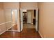 Bedroom with hardwood flooring and entryways to the hall and ensuite bath at 2208 Fiero Dr, Las Vegas, NV 89134