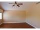 Spacious bedroom with hardwood floors, neutral walls, large windows, and a ceiling fan at 2208 Fiero Dr, Las Vegas, NV 89134