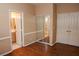 Bedroom featuring hardwood floors, a mirrored closet, and ensuite bathroom at 2208 Fiero Dr, Las Vegas, NV 89134