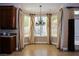 Breakfast nook featuring large bay windows and elegant chandelier at 2208 Fiero Dr, Las Vegas, NV 89134