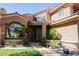 Exterior of home featuring well-maintained landscaping, a covered front porch, and large windows at 2208 Fiero Dr, Las Vegas, NV 89134