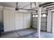 Well-organized garage with cabinets for storage and parking at 2208 Fiero Dr, Las Vegas, NV 89134