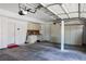 Functional garage with cabinets, workspace, and parking at 2208 Fiero Dr, Las Vegas, NV 89134