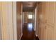 Hallway with hardwood floors, neutral paint, and built-in cabinets for storage at 2208 Fiero Dr, Las Vegas, NV 89134