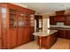 Gourmet kitchen with custom cabinetry and granite countertops, adjacent stainless steel fridge at 2208 Fiero Dr, Las Vegas, NV 89134