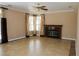 Large living room features tiled flooring, fireplace, and neutral decor at 2208 Fiero Dr, Las Vegas, NV 89134