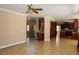 Open-concept living space with tiled floors seamlessly connecting to the kitchen area at 2208 Fiero Dr, Las Vegas, NV 89134