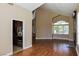 Open living room showcasing beautiful hardwood floors, fireplace, and natural light at 2208 Fiero Dr, Las Vegas, NV 89134
