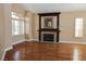 Bright and inviting living room featuring wood floors and a charming fireplace at 2208 Fiero Dr, Las Vegas, NV 89134