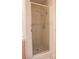 Modern shower with a glass door, marble tile surround, and dual shower heads at 2208 Fiero Dr, Las Vegas, NV 89134