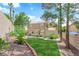 Large grassy backyard with brick borders at 2417 Chestnut Hill St, Las Vegas, NV 89134