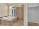Bathroom featuring a glass shower, soaker tub, and direct access to walk-in closet at 2417 Chestnut Hill St, Las Vegas, NV 89134