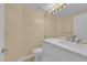 Modern bathroom features a sleek vanity with a marble countertop, stylish fixtures, and tile flooring at 2417 Chestnut Hill St, Las Vegas, NV 89134